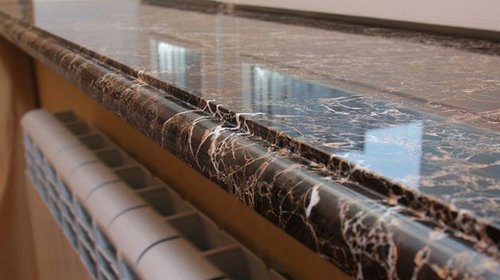 Подоконники из камня: натуральные или искусственные?