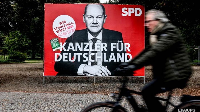 Партия Меркель теряет поддержку перед выборами - опрос